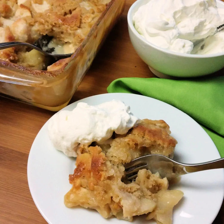 A serving of German Apple Cake with whipped cream