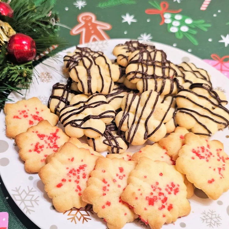 Spritz cookies cooking on cookie sheet