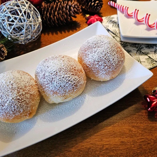 3 Berliner donuts on a plate at Christmas