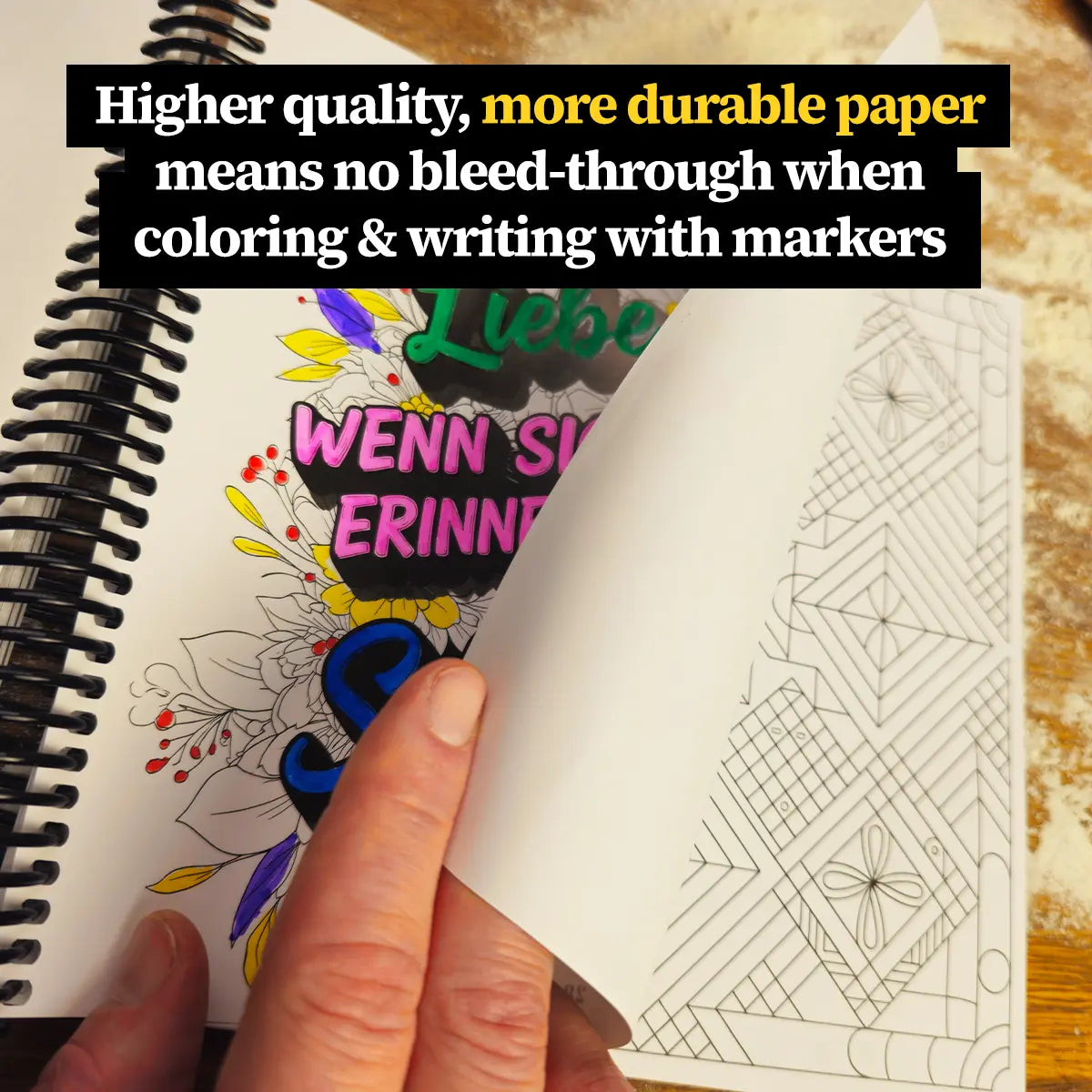Close-up of More Baking Just Like Oma Journal Edition spiral cookbook showing thick, high-quality paper for coloring and writing without bleed-through.